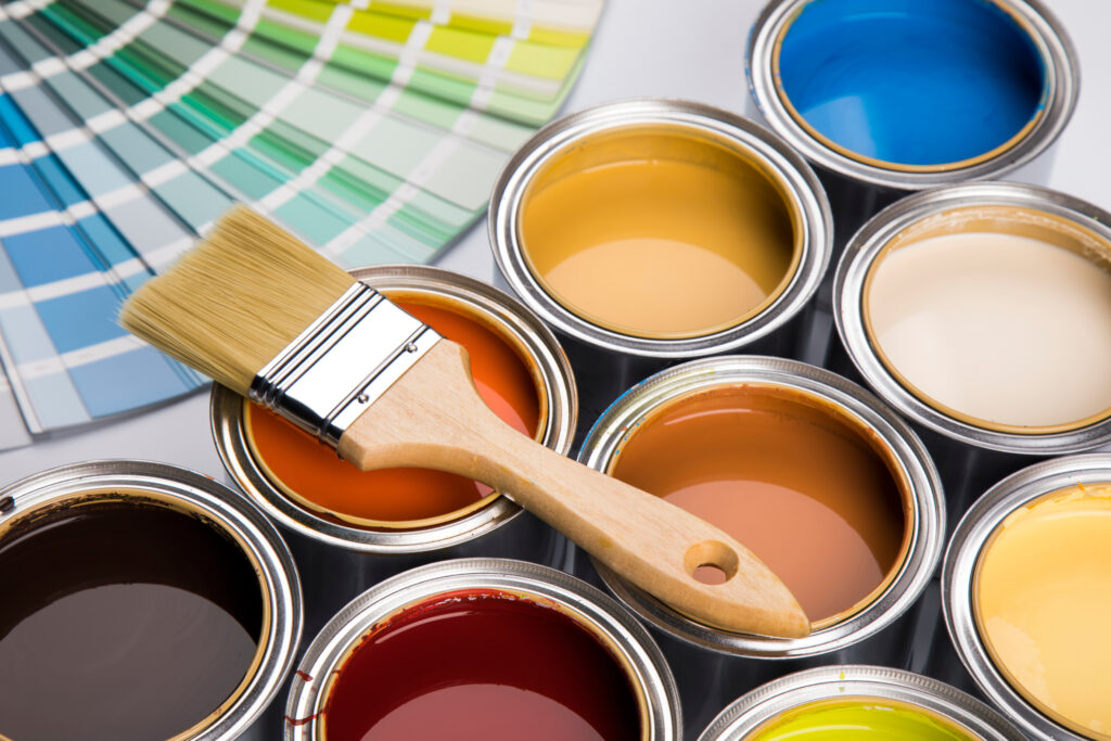 Colorful paint cans with paintbrush