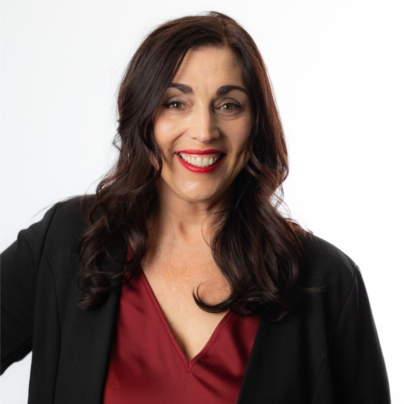 Laura Maffucci headshot - woman smiling with long dark hair.