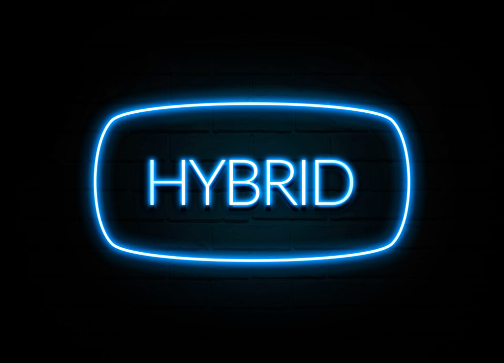 Hybrid  - colorful Neon Sign on brickwall