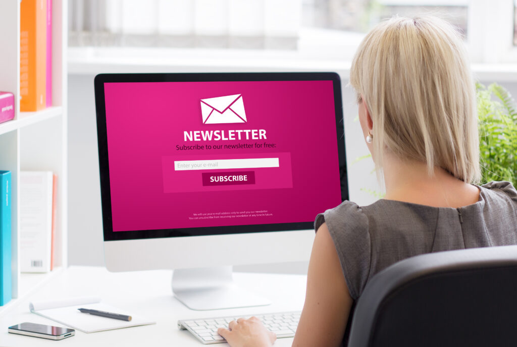 Woman subscribing to newsletter on a website