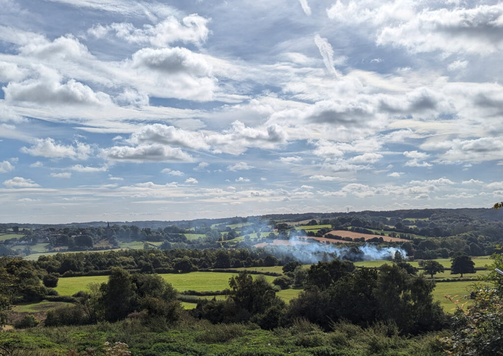 Derbyshire view of fields, trees and cloudy blue sky (C) Cathy Hoy