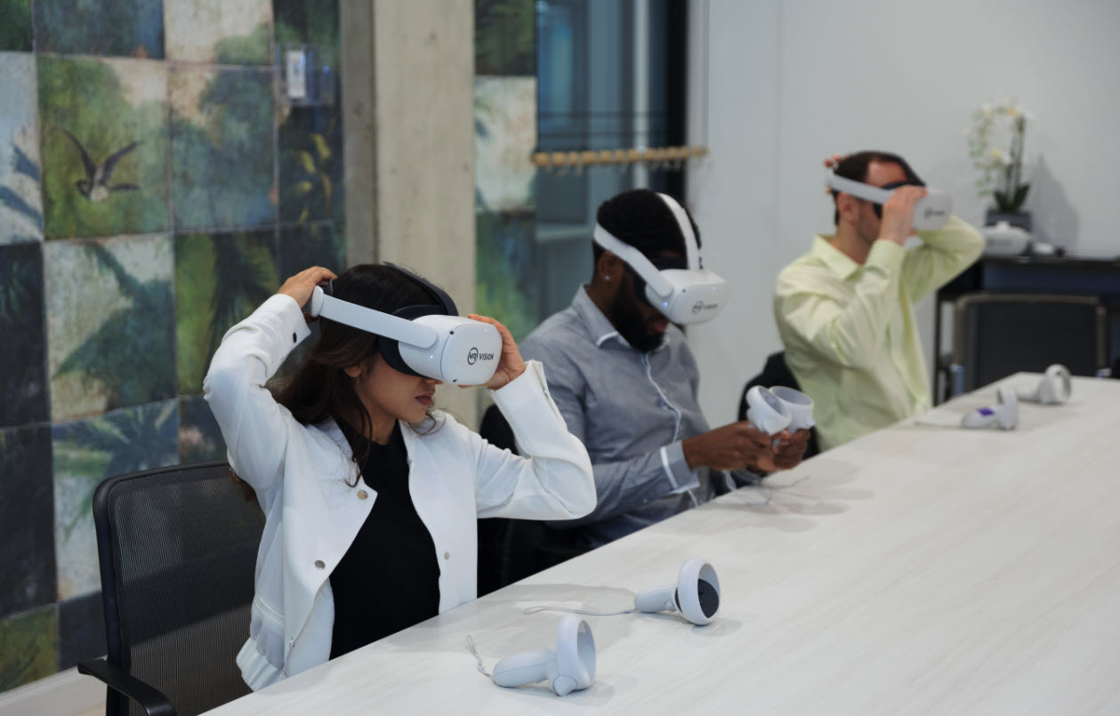 People in an office wearing VR googles.