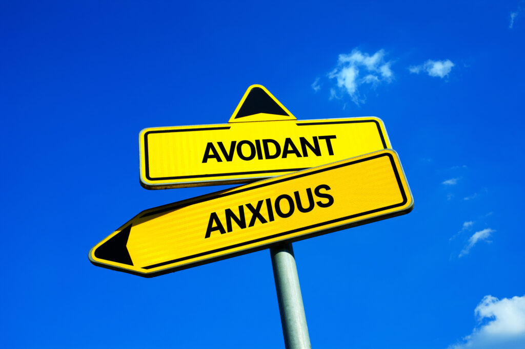 Avoidant vs Anxious  - Traffic sign with two options - difference and comparison between attachment styles. Love relationship and dynamics between partners. Toxic and unhealthy romantic partnership.