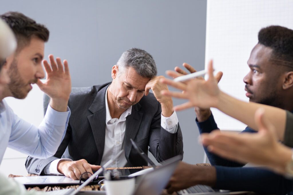 Business People Arguing In Meeting